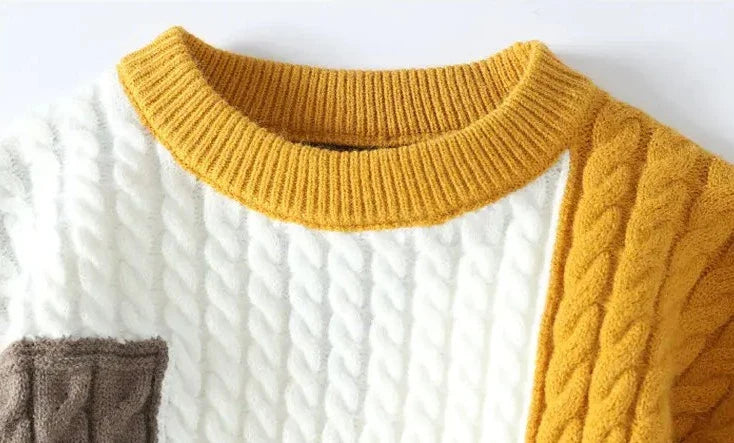 Norway neck sweater with elegant cable knit design in solid colors.