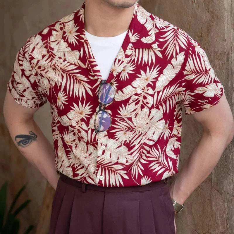 Vintage Hawaiian flower shirt in red with white floral pattern, perfect for casual summer wear.