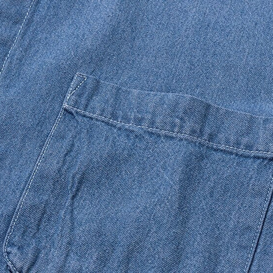Close-up of Business Casual Denim Shirt with solid pattern and chest pocket.