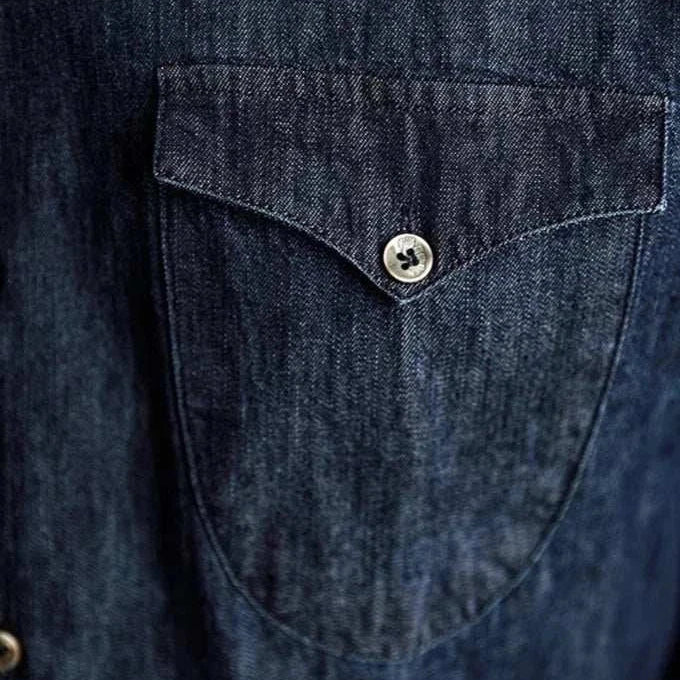 Close-up of Office premium denim shirt pocket detail.