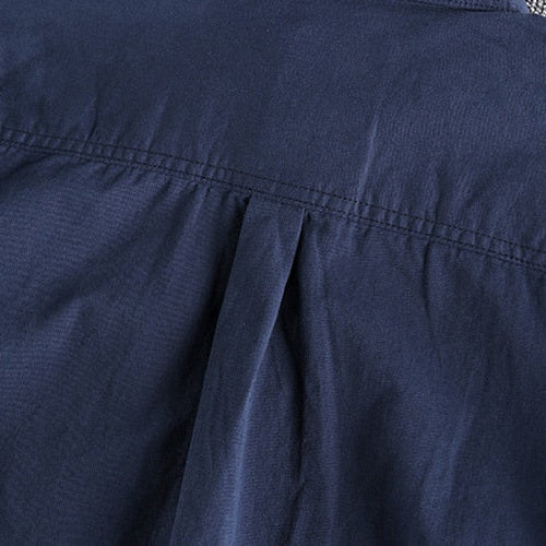 Vintage-retro cotton shirt with solid pattern, close-up of fabric and stitching details.