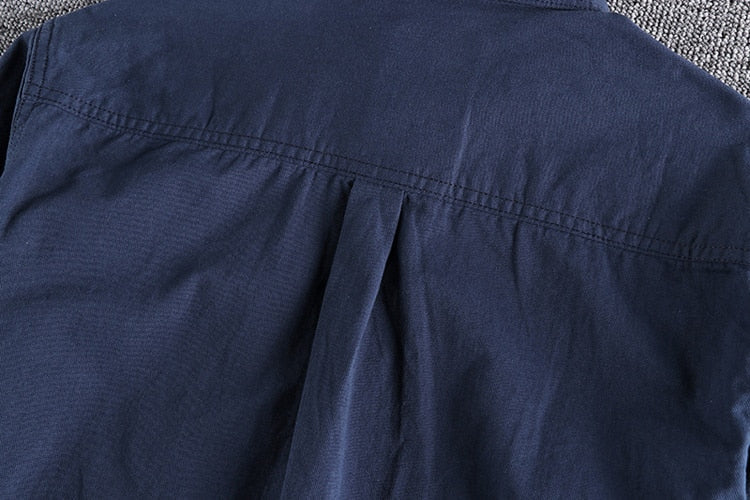 Vintage-retro cotton shirt with solid pattern, close-up of fabric and stitching details.