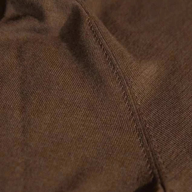 Close-up of fabric texture in Antonios slim fit half-turtleneck sweater.