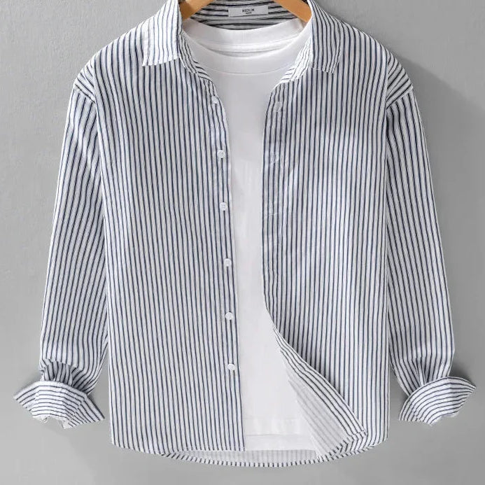 Pure cotton classic shirt with blue stripes hanging on a hanger.