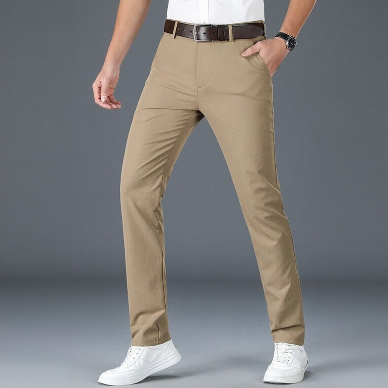 Men wearing khaki Antonios Stretch Pants and white sneakers.