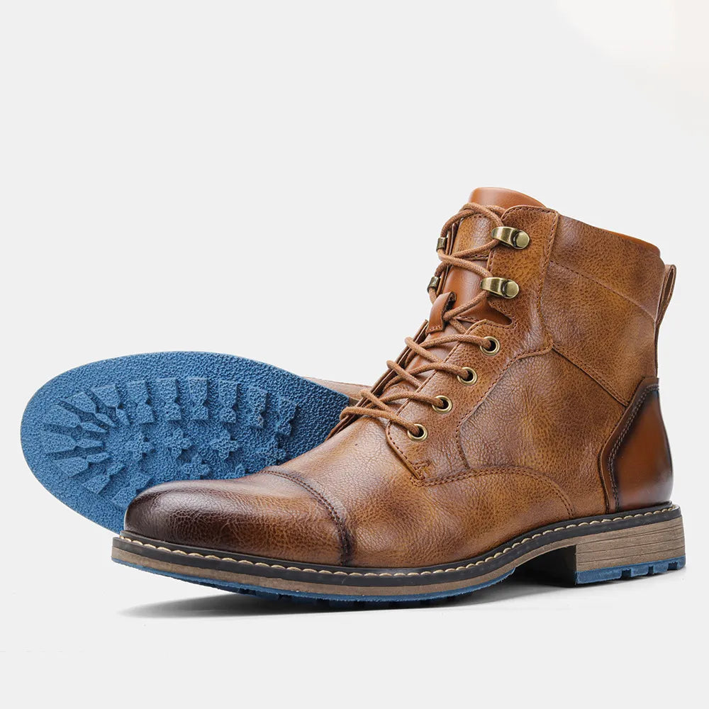 Brown ANT ankle boots with a classic, minimalist design and blue rubber sole.