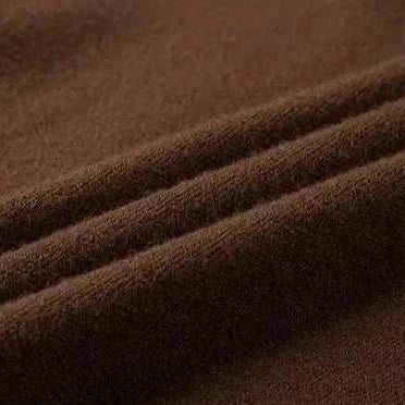 Close-up of brown fabric texture of Korean smart casual sweater.
