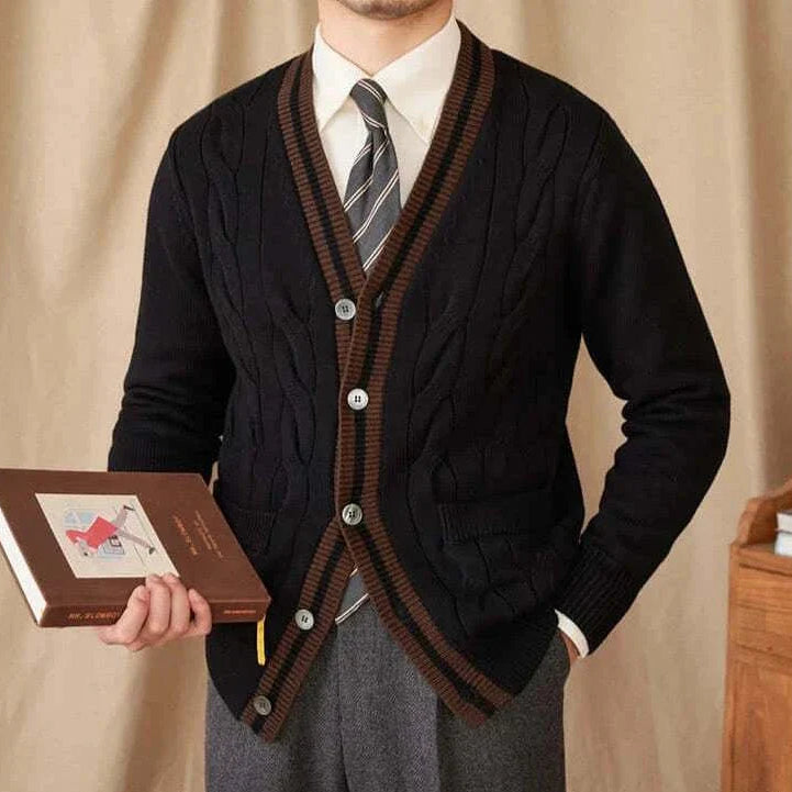Antonios twisted knit cardigan in Italian vintage style, black with brown trim, worn by a man holding a book.
