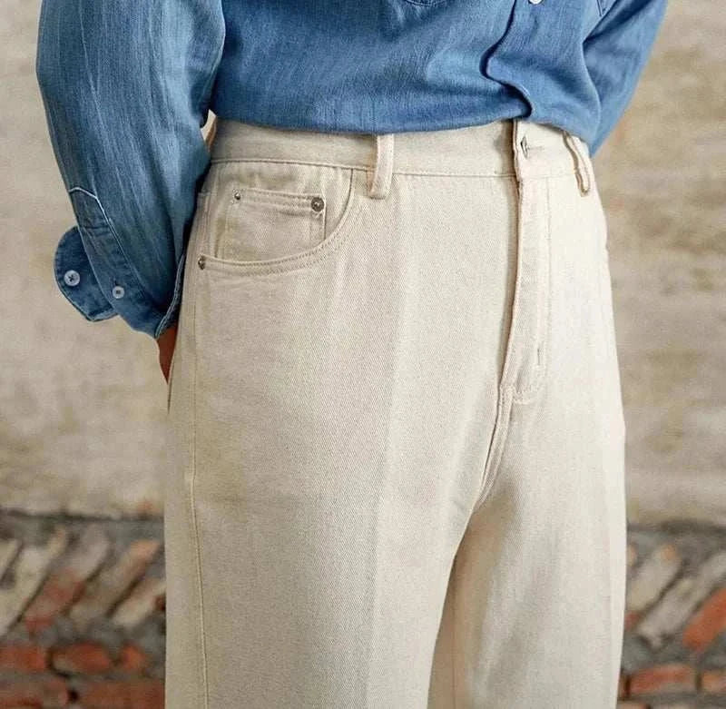 British pure cotton old money pants in a light color worn with a denim shirt, showcasing classic style and comfort.