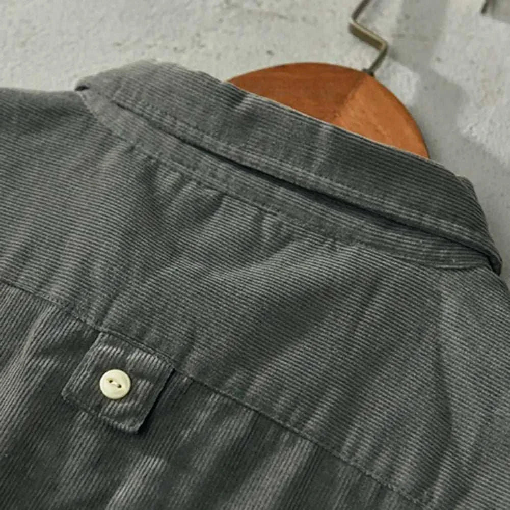 Corduroy cargo spring shirt with solid pattern and button detail, ideal for men's casual or office style.