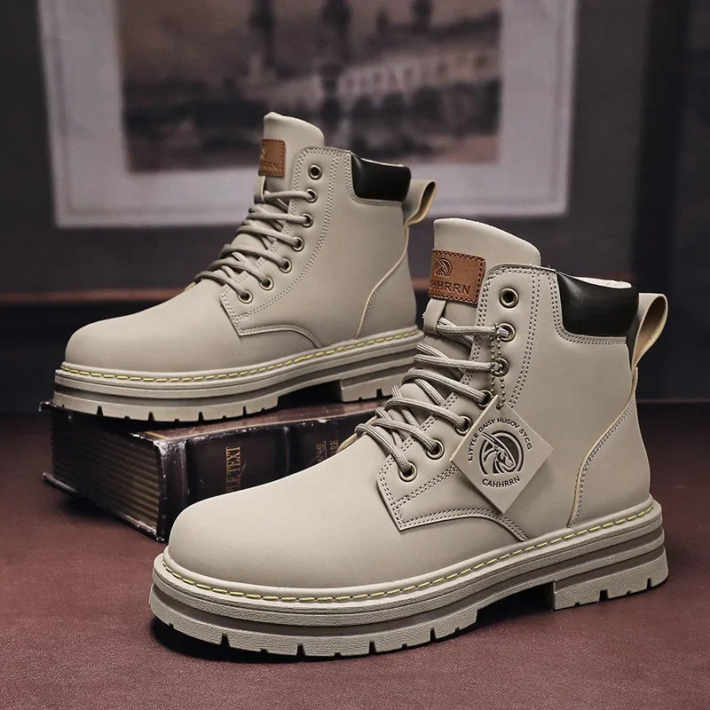 ANT military design boots in khaki color on a dark surface, featuring a minimalist style and high-quality material.