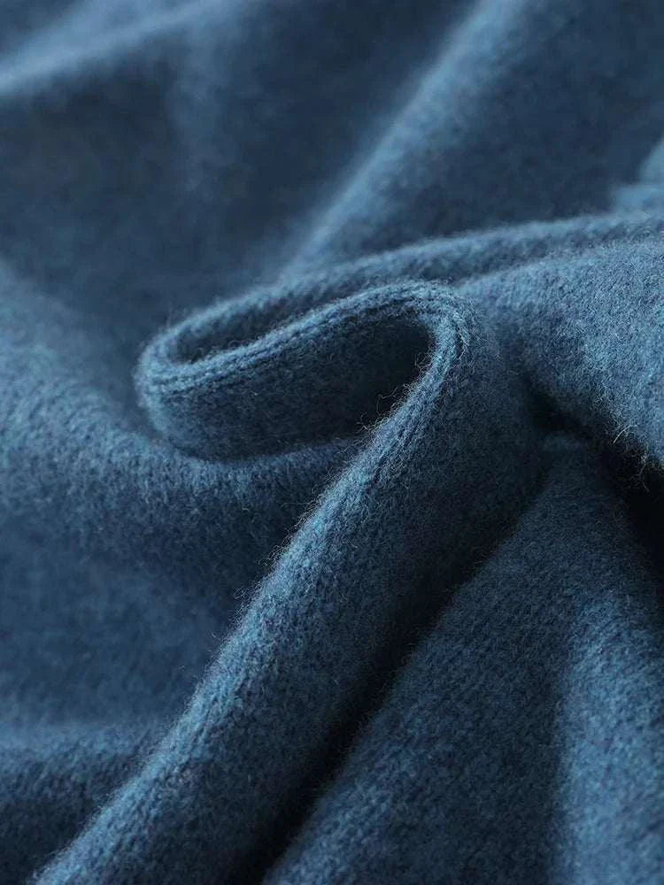 Luxury wool casual sweater fabric close-up showing texture.