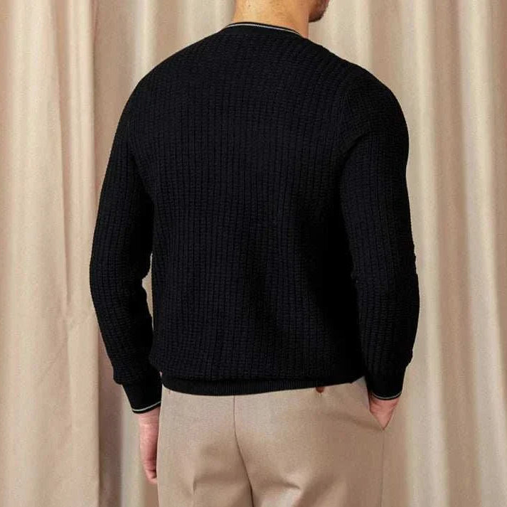 Back view of a men's black winter wool sweater, featuring a cozy and stylish design for cold weather.