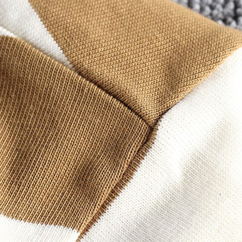 Close-up of the fabric texture of a Summer Striped T-Shirt in white and camel stripes.