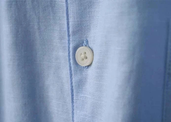 Close-up of Antonios cotton-linen long sleeve shirt, showcasing fabric texture and button detail.