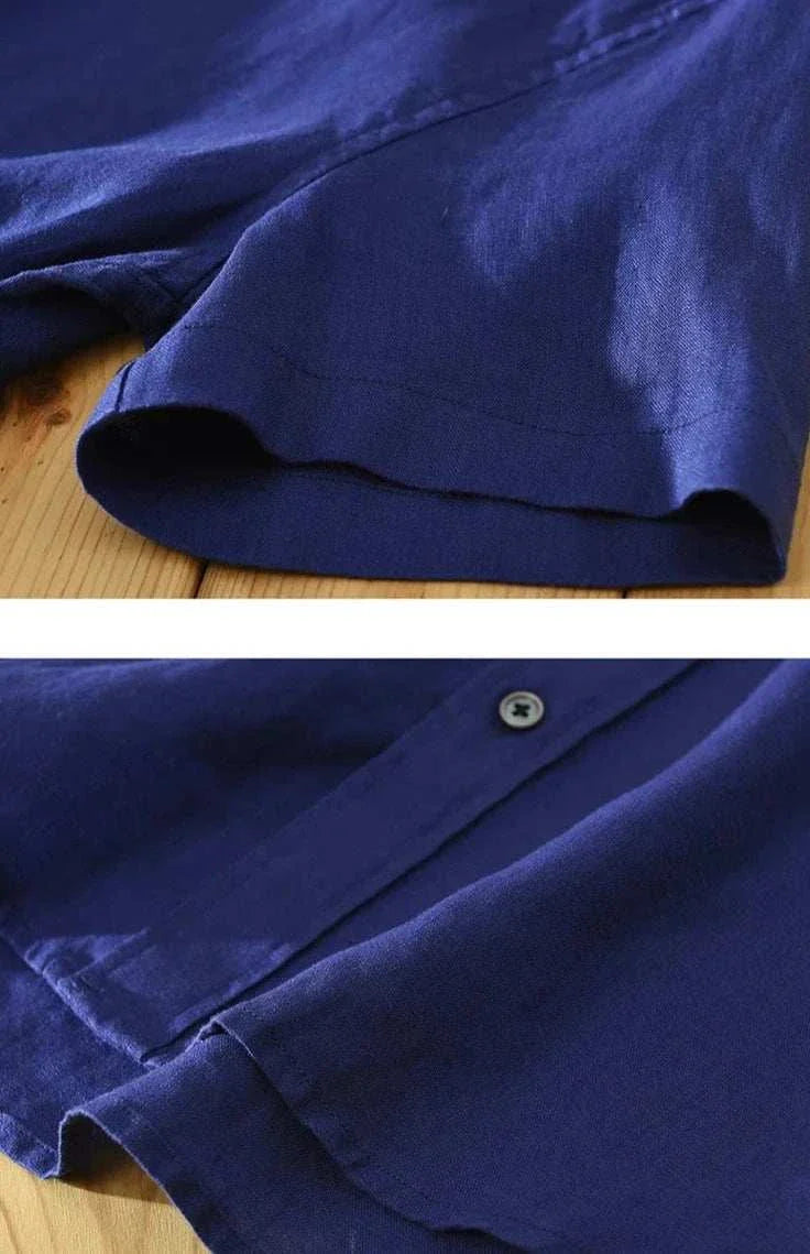 Antonios loose short sleeve summer shirt in solid blue linen fabric close-up.