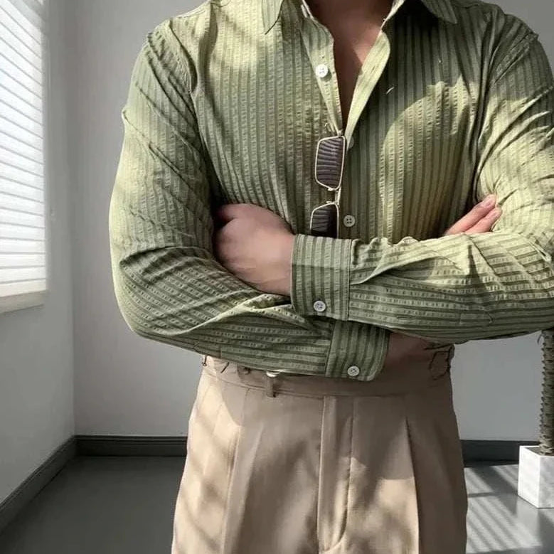 Antonios British casual striped shirt in olive green, classic collar, paired with beige pants.