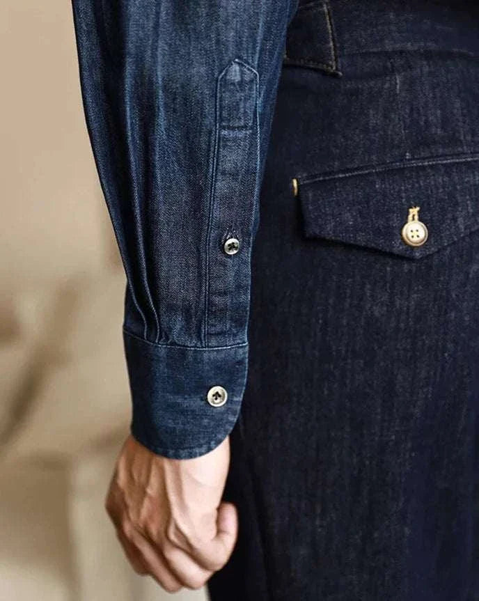 Office premium denim shirt with buttoned cuffs and classic collar style.
