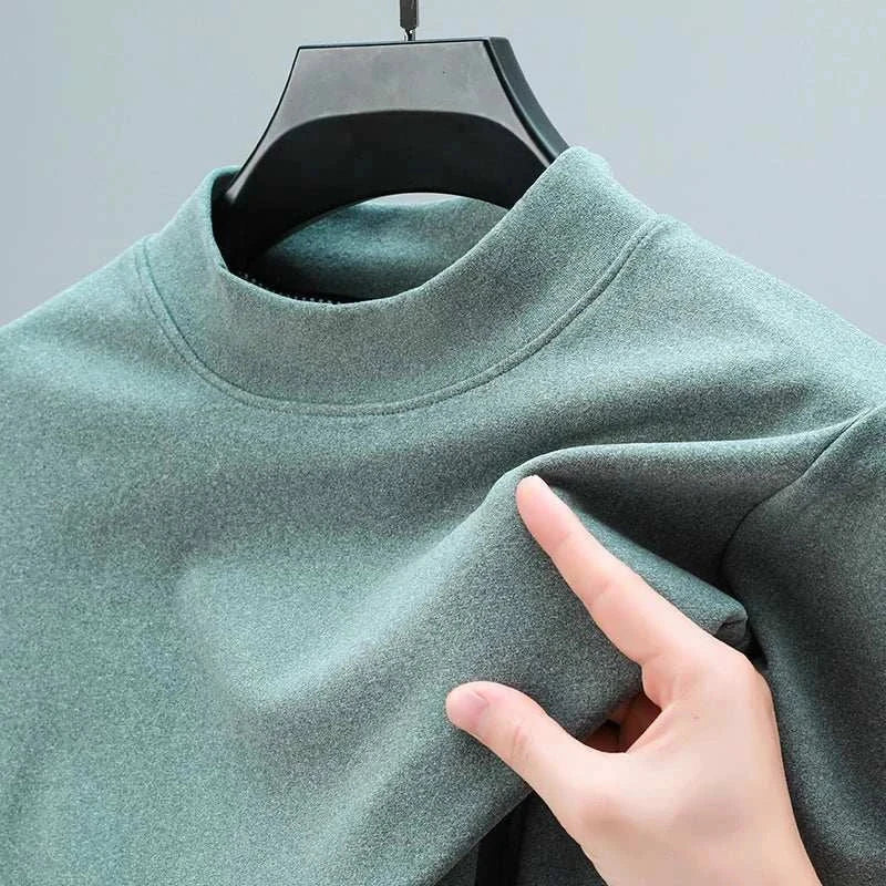 Classic turtleneck sweater in a solid green pattern, showcasing soft cotton fabric.