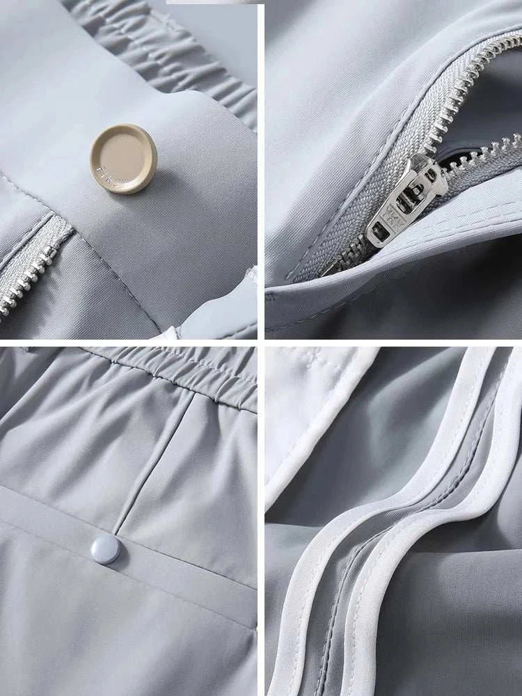 Close-up of gray business chino pants showcasing button, zipper, waistband, and pocket details made with spandex.