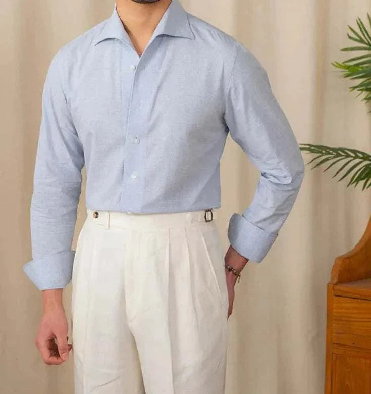 Piece collar casual long-sleeve shirt in light blue, worn by a man, made from linen and cotton blend.