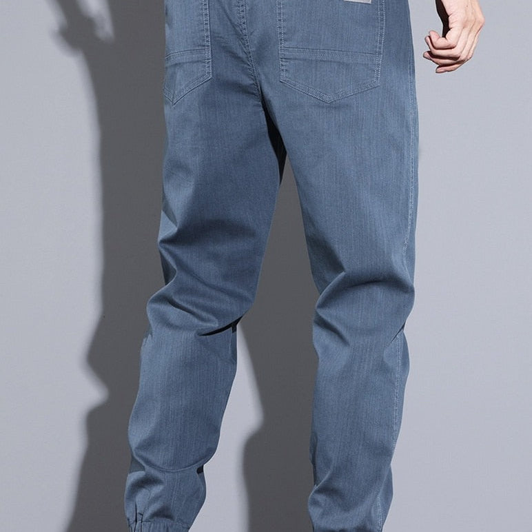Vinny Loose Pants in blue; men's relaxed fit jogging pants; cotton and polyester; casual style.