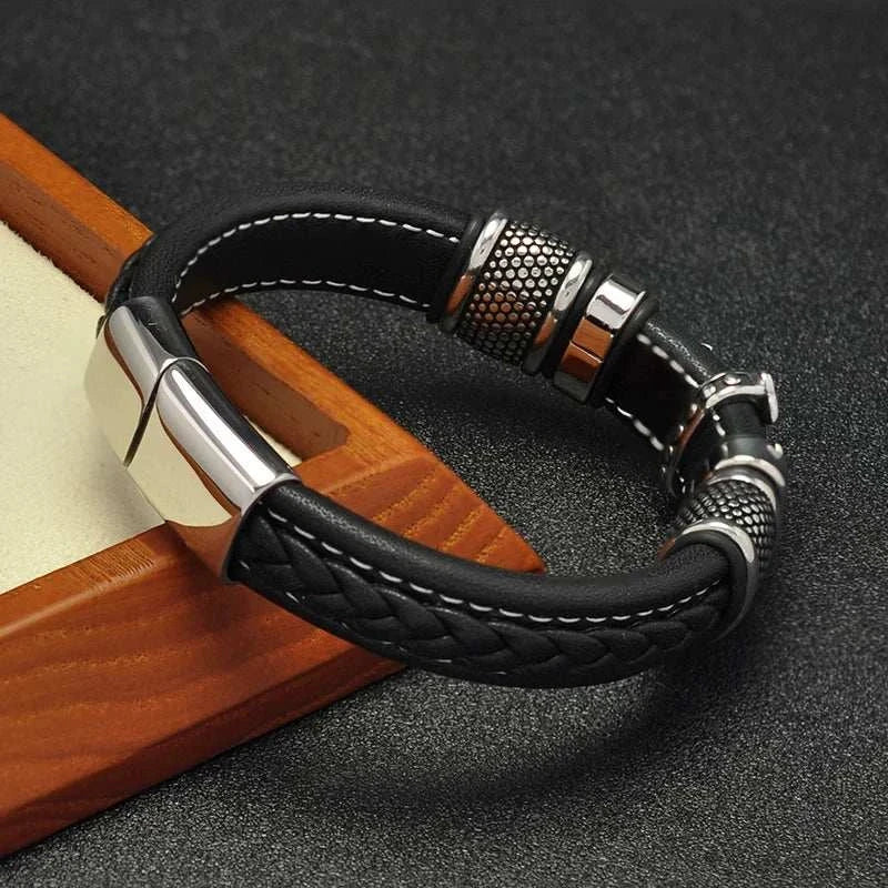 Cross punk leather bracelet with stainless steel accents.