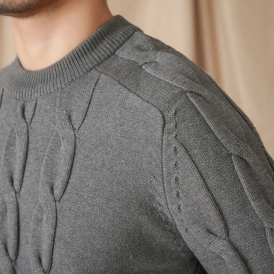 Round neck vintage sweater in gray with textured pattern.