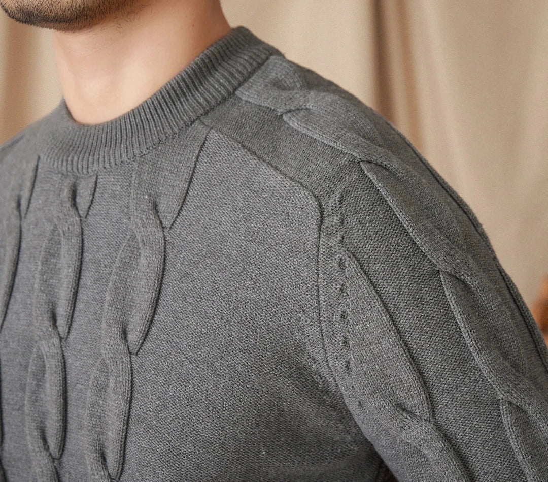 Round neck vintage sweater in gray with textured pattern.