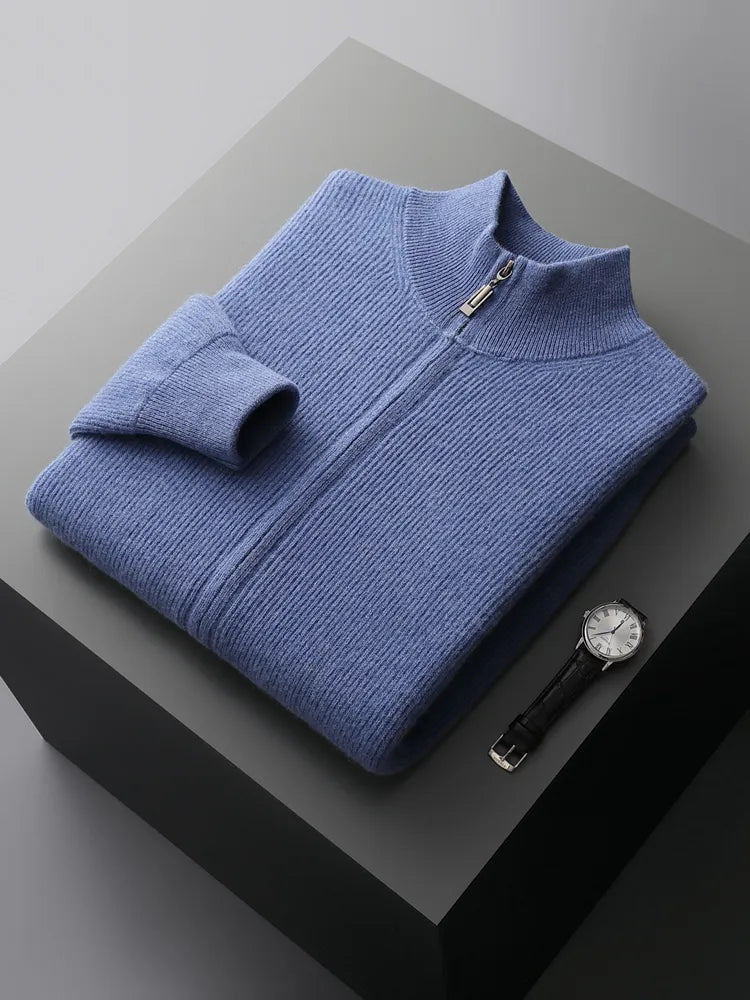 Blue pure wool cardigan on display with a folded sleeve and a watch beside it.