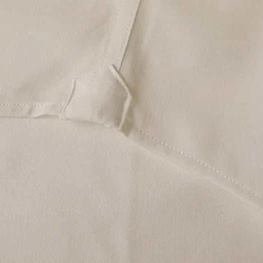 Close-up view of Antonios washed tuxedo shirt fabric showing stitching detail for stylish office wear.