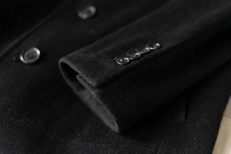 Black single breasted trench coat sleeve detail with buttons.