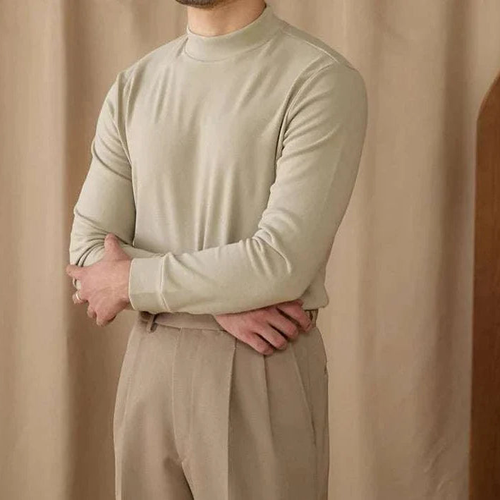 Soft half turtleneck sweater in light beige on a person, showcasing cozy fit and style.