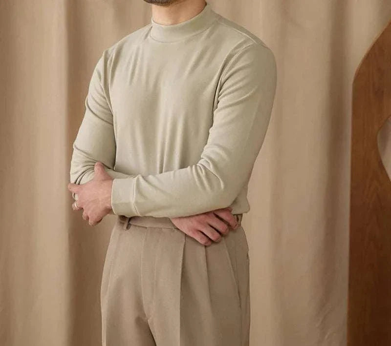 Soft half turtleneck sweater in light beige on a person, showcasing cozy fit and style.