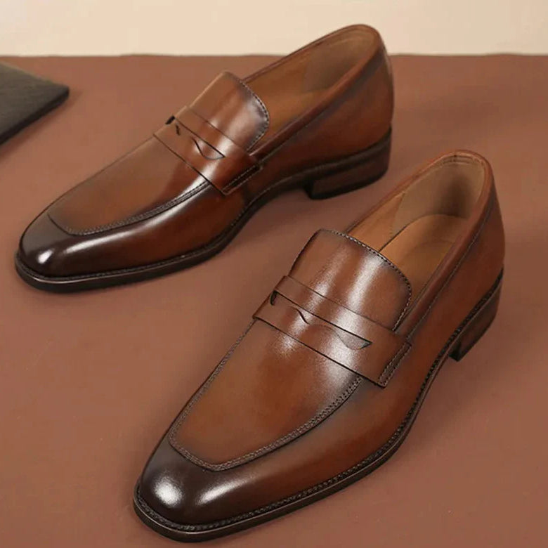 Italian luxury slip-on shoes in brown leather, elegant design for men.