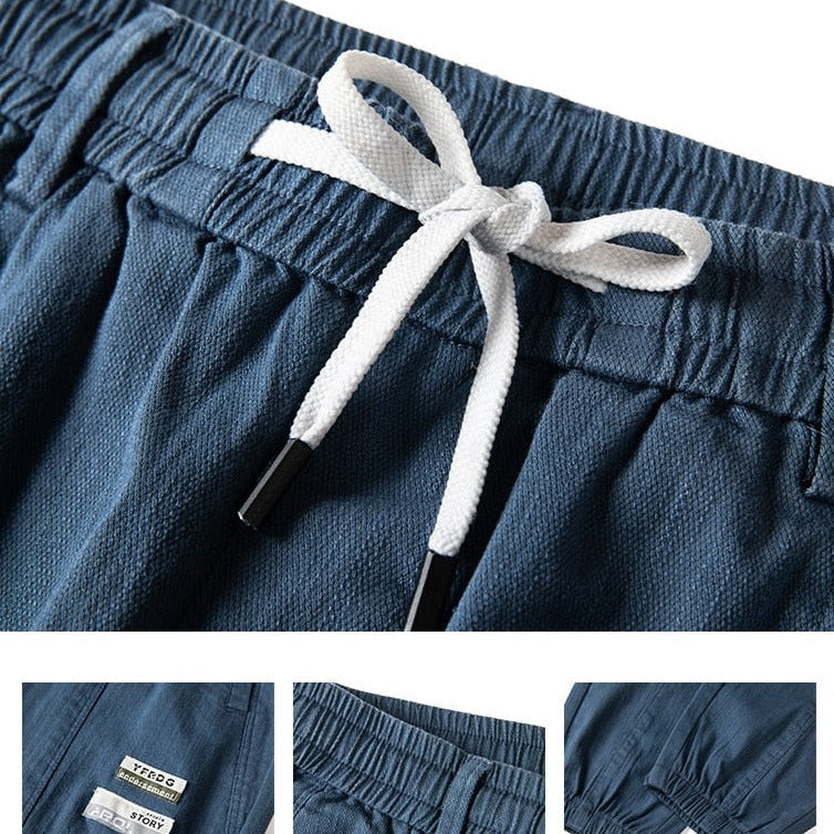 Vinny Loose Pants in blue with drawstring waistband and relaxed fit details.