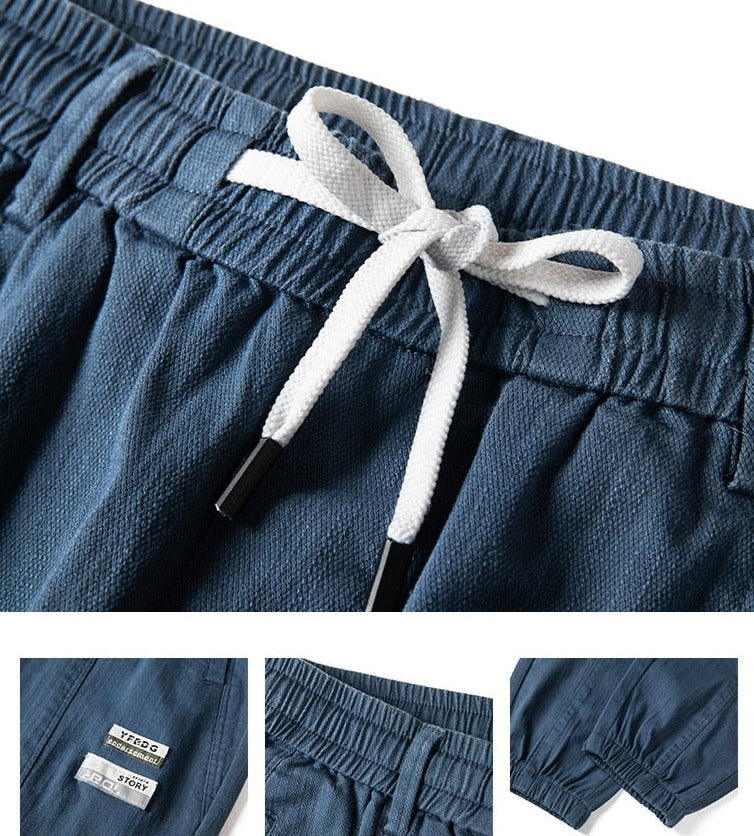 Vinny Loose Pants in blue with drawstring waistband and relaxed fit details.