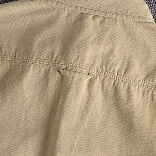 Vintage-retro cotton shirt with beige fabric and a solid pattern.