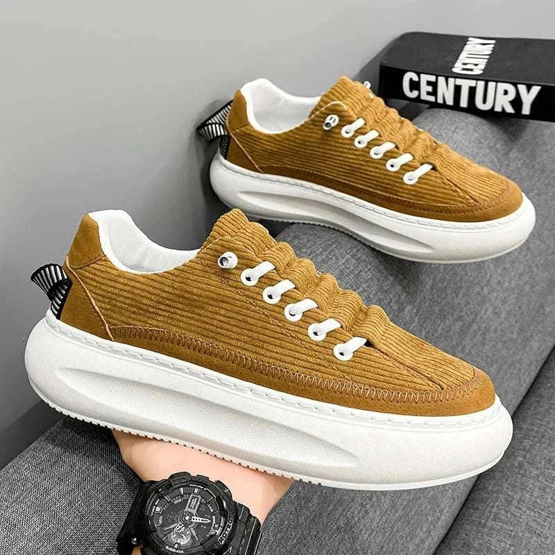 Cricket bulb shoes in brown with breathable and comfortable design on a gray background.