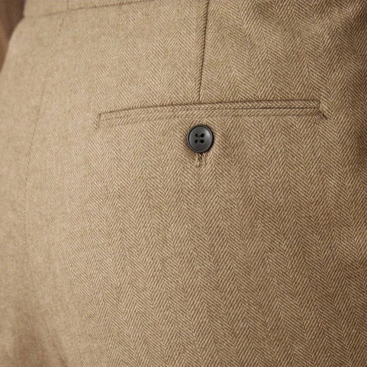 Close-up of Wool winter Italian trousers with button detail.