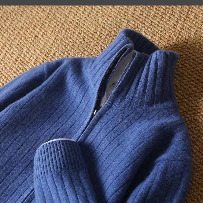 Antonios business casual cardigan in blue with zippered collar, ribbed texture on a textured surface.