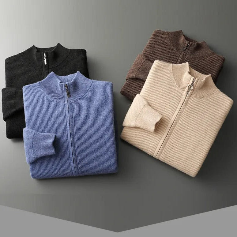 Folded pure wool cardigans in black, blue, brown, and beige on display.