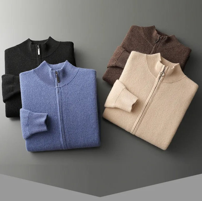 Folded pure wool cardigans in black, blue, brown, and beige on display.