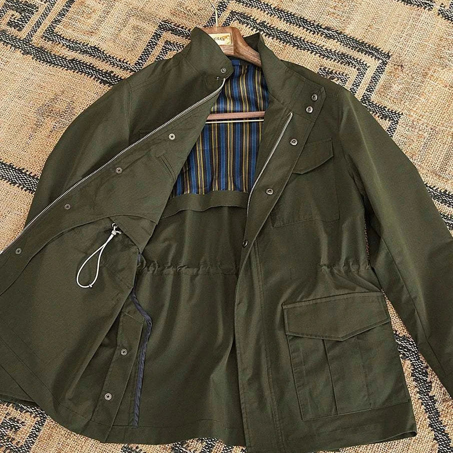 British old money jacket in high-quality cotton, olive green with striped lining, elegant and sophisticated.