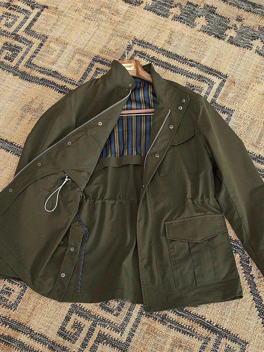 British old money jacket in high-quality cotton, olive green with striped lining, elegant and sophisticated.