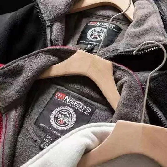 Norway puffer jacket in multiple colors with label details on hangers.