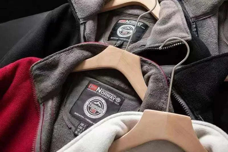 Norway puffer jacket in multiple colors with label details on hangers.