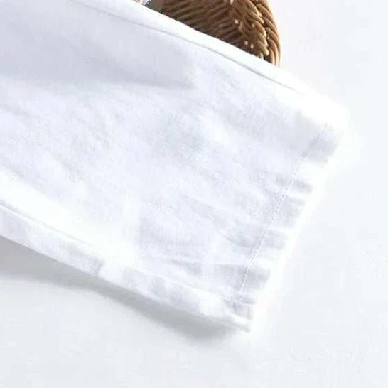 White straight oversize trousers made from 100% polyester for a casual and sophisticated look.