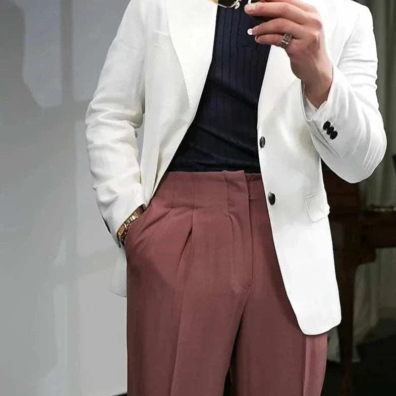 British polo collar t-shirt styled with a white blazer and brown trousers for a smart casual look.