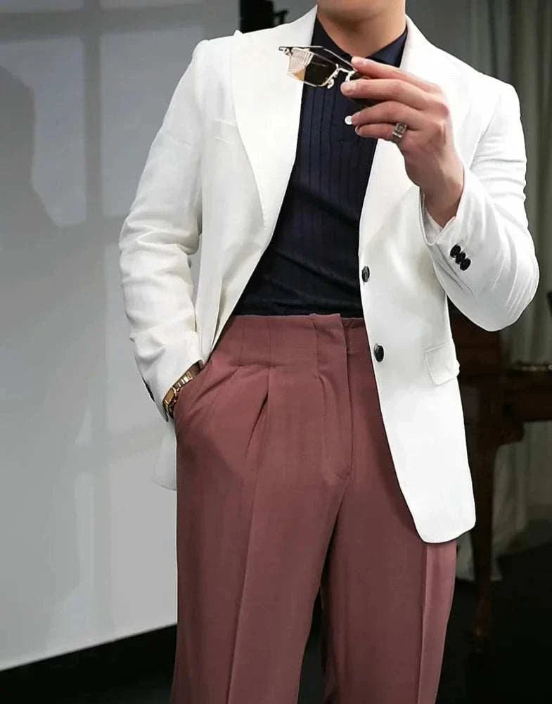 British polo collar t-shirt styled with a white blazer and brown trousers for a smart casual look.